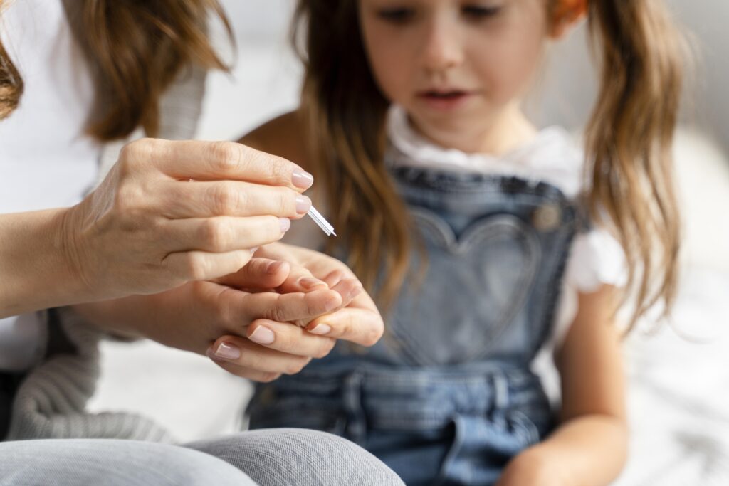 Mother is cleaning her child nails
